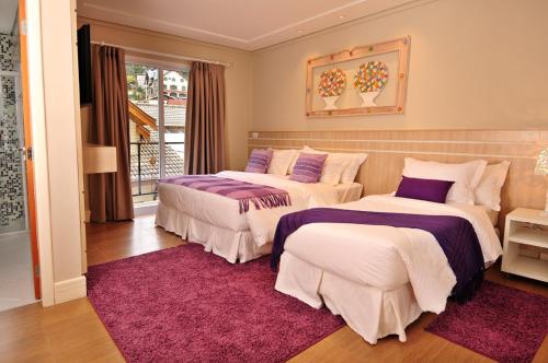 Standard Triple Room room in Pousada Annecy - CAPIVARI Fácil acesso ao centrinho e Baden Bar