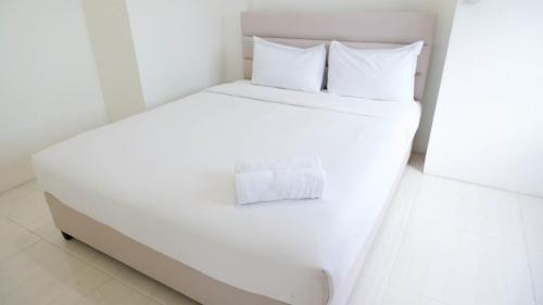 2BR Apartment at Puncak Bukit Golf Surabaya near Lenmarc Mall By Travelio, Surabaya
