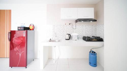 Kitchen, Best Choice 2BR at Puncak Dharmahusada Apartment Surabaya By Travelio near Warung ana jaya