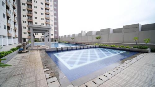 Exterior view, Best Choice 2BR at Puncak Dharmahusada Apartment Surabaya By Travelio near Warung ana jaya