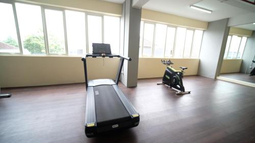 Fitness center, Best Choice 2BR at Puncak Dharmahusada Apartment Surabaya By Travelio near Warung ana jaya