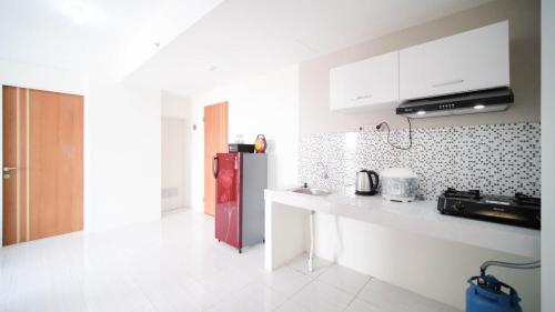 Kitchen, Best Choice 2BR at Puncak Dharmahusada Apartment Surabaya By Travelio near Warung ana jaya