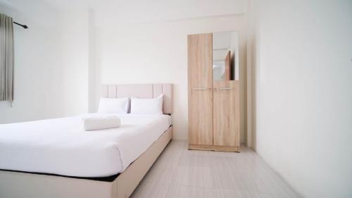 Best Choice 2BR at Puncak Dharmahusada Apartment Surabaya By Travelio near Warung ana jaya