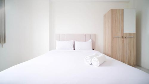Best Choice 2BR at Puncak Dharmahusada Apartment Surabaya By Travelio, Surabaja