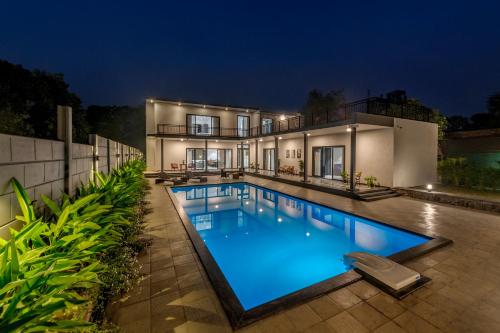 SaffronStays Mayfair Gardens - 4BR pet-friendly pool villa with patio, den, board games & modern interiors near jetty, Alibaug