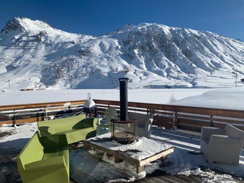 Chalet Canvolan, 7 pièces, 12 personnes, Tignes le Lac, sur terrasse et jardin - Location saisonnière - Tignes