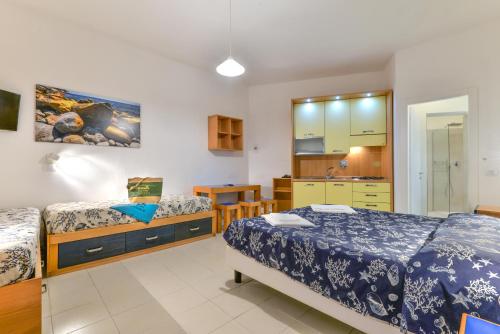 Studio (3 Adults) room in Residence Le Acacie