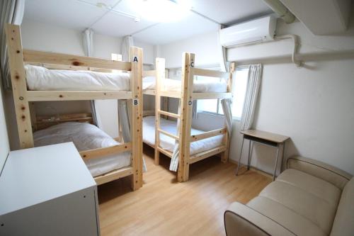 Quadruple Room with Shared Bathroom room in Glocal Nagoya Backpackers Hostel