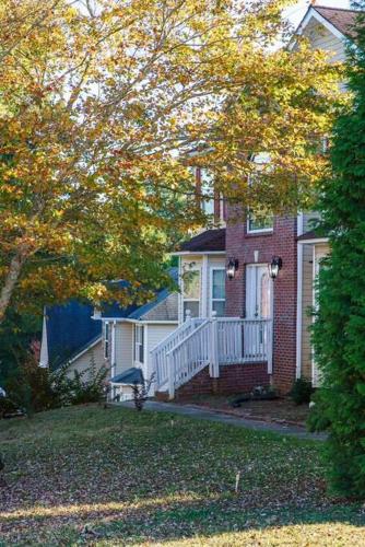 Exterior view, Deck, BBQ Grill, Backyard Fire Pit, Pool, Jacuzzi Tub, 65 inch TV in South Fulton