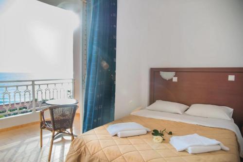 Poseidon Beach Hotel - Tap to explore photos