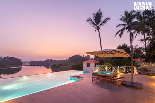 StayVista's Waterway Retreat - Lakeside Oasis with Infinity Pool