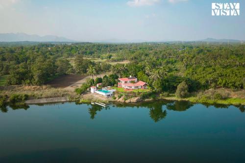 StayVista's Waterway Retreat - Lakeside Oasis with Infinity Pool