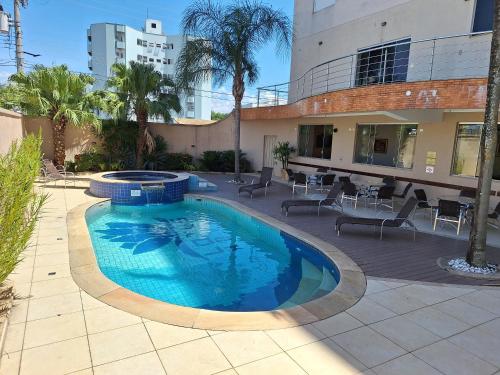 สระว่ายน้ำ, Lotus Hotel - à 6 km do Santuário de Aparecida-SP (Lotus Hotel - a 6 km do Santuario de Aparecida-SP) in กวาราตินกิวต้า