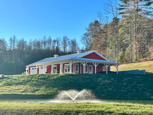 The Double B A Modern Farmhouse with a fire pit hot tub and pond view