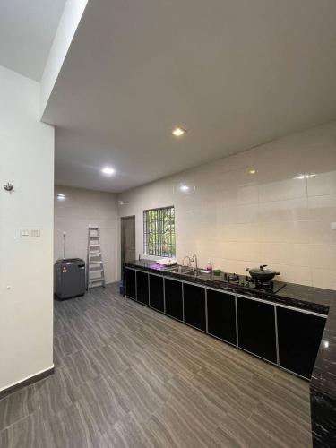 Kitchen, three bedroom tarraced house - RainaHomestay Pasir Gudang near Super Lobster Restaurant