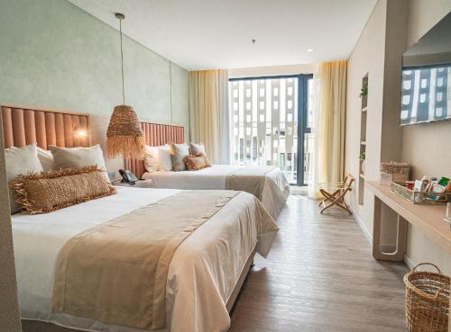 An elegant room with two beds in a San Andres, Colombia resort