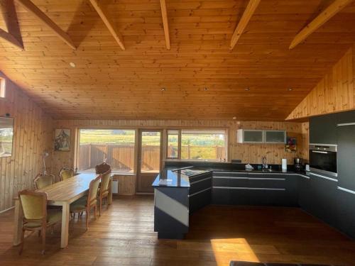 Glass House with Private River & 360° Views in Arnarstapi