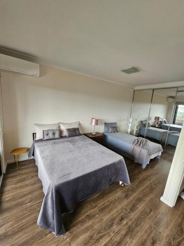 Book a Spacious room with a balcony for your stay with shared bathroom laundry kitchen and living area