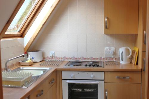 кухня, Lochinver Holiday Lodges & Cottages in Лочінвер