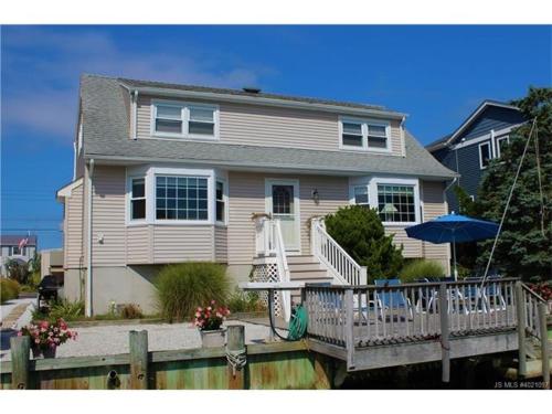 Your Boat Is Welcome At This Lagoon Front Home! in Brant Beach, USA