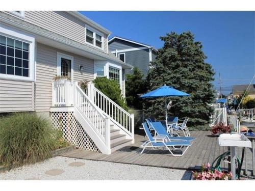 Your Boat Is Welcome At This Lagoon Front Home! in Brant Beach, USA