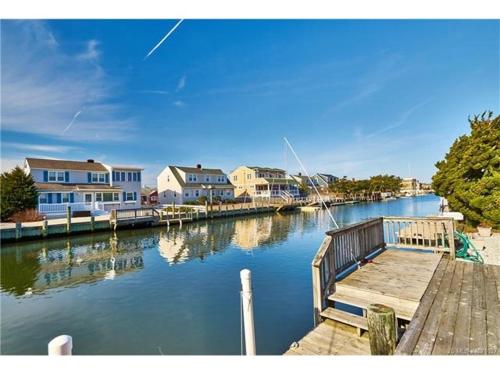 Your Boat Is Welcome At This Lagoon Front Home! in Brant Beach, USA
