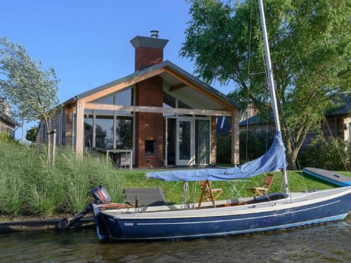 Modern bungalow with an outdoor fireplace by the water