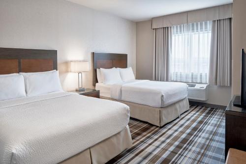 One-Bedroom Queen Suite with Two Queen Beds and Sofa Bed - Full Size Kitchenette