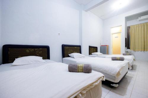 OYO 485 Marcello Residence Room Type - Triple Room