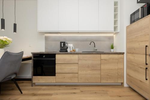 Łopuszańska Apartment with Balcony in Warsaw by Noclegi Renters, Warszawa (zdjęcie 11)