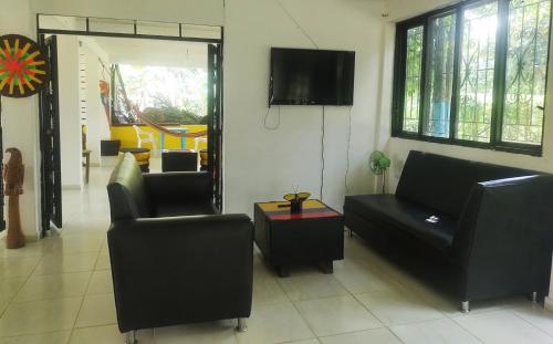 Koplietošanas atpūtas telpa ar TV, Amalaya Hostel in Restrepo