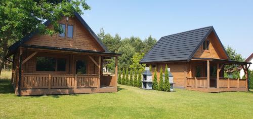 . Domki z bala przy plaży Orle Jezioro Głuszyńskie