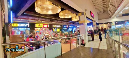 Taj Suites & Studios-Top Place Couple Friendly Stay at Luxury Gaur City Mall #Movie, #Food Court #Shopping