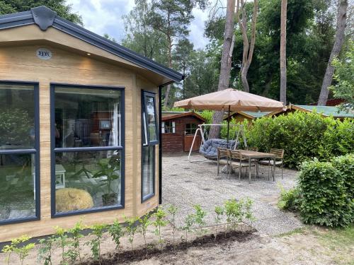 Luxury chalet on cozy family campsite. in Garderen