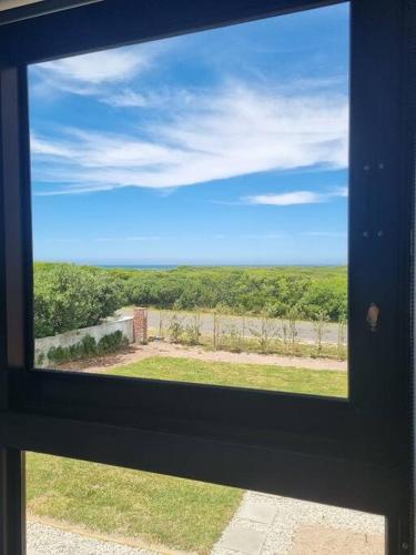 Rodyti, Uitwaaien Beach Cottage in Perlų paplūdimys