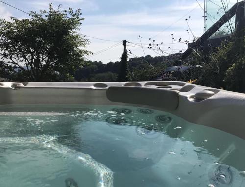 A Cotswold Cabin with Great Views and a Hot Tub in Whiteshill