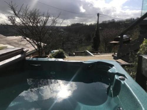 A Cotswold Cabin with Great Views and a Hot Tub in Whiteshill