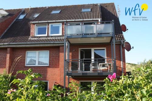 Зовнішній вигляд готелю, Haus Janine Ferienwohnung Meeresblume in Юйст