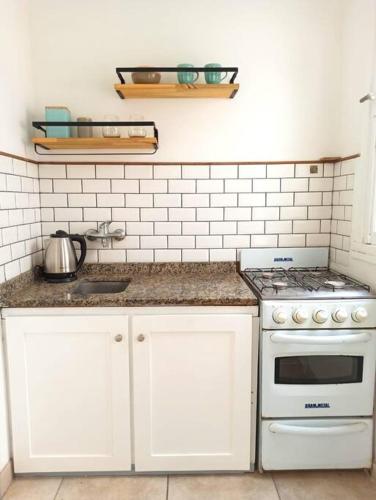 Cozinha, Departamento del Mar con patio y parrilla in Próximo do Centro