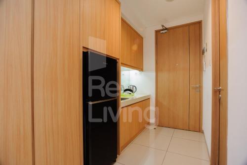 RedLiving Apartemen TreePark City - Hunian Idamanku Tower Alpine