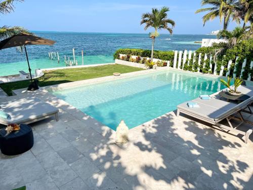 Luxury Beachfront Hotel Zone Villa with Private Pool by Solmar Rentals - Tap to explore photos