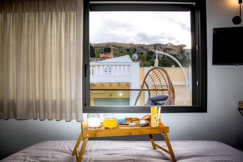 Athens Muses Suites - Tap to explore photos