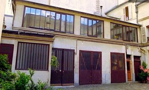 Loft character with a view of court - Location saisonnière - Paris