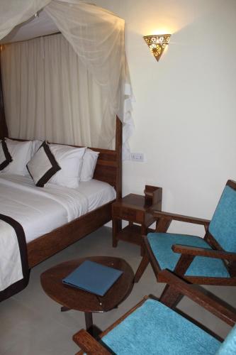 The Island Stone Town Hotel - Tap to explore photos
