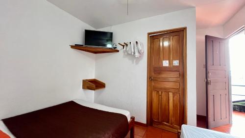 Hostal Nuevo Arenal downtown, private rooms with bathroom