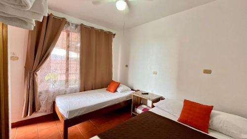 Hostal Nuevo Arenal downtown, private rooms with bathroom