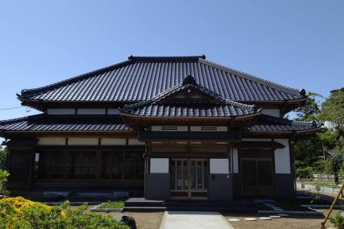 Traditional Japanese house with cherry blossoms