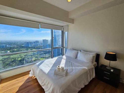 The Infinity Towers in BGC - Simple, Elegant & Spacious 2 Bedroom, Манила