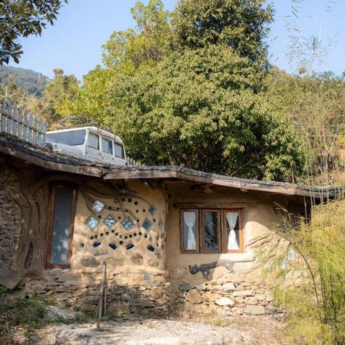 Hidden Earthen Home With An SUV Car As Entrance