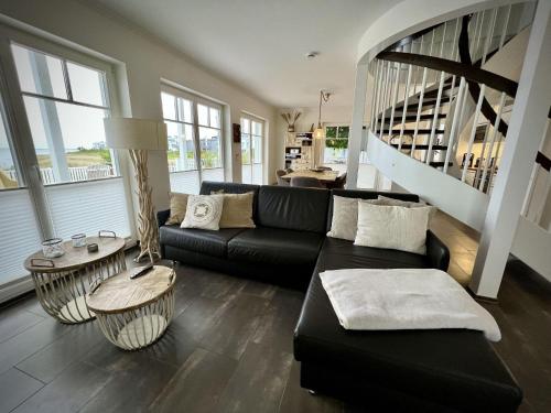 Ferienhaus-Sliminde-by-Seeblick-Ferien-direkte-Wasserlage-E-Ladesaeule-Sauna in Olpenitz